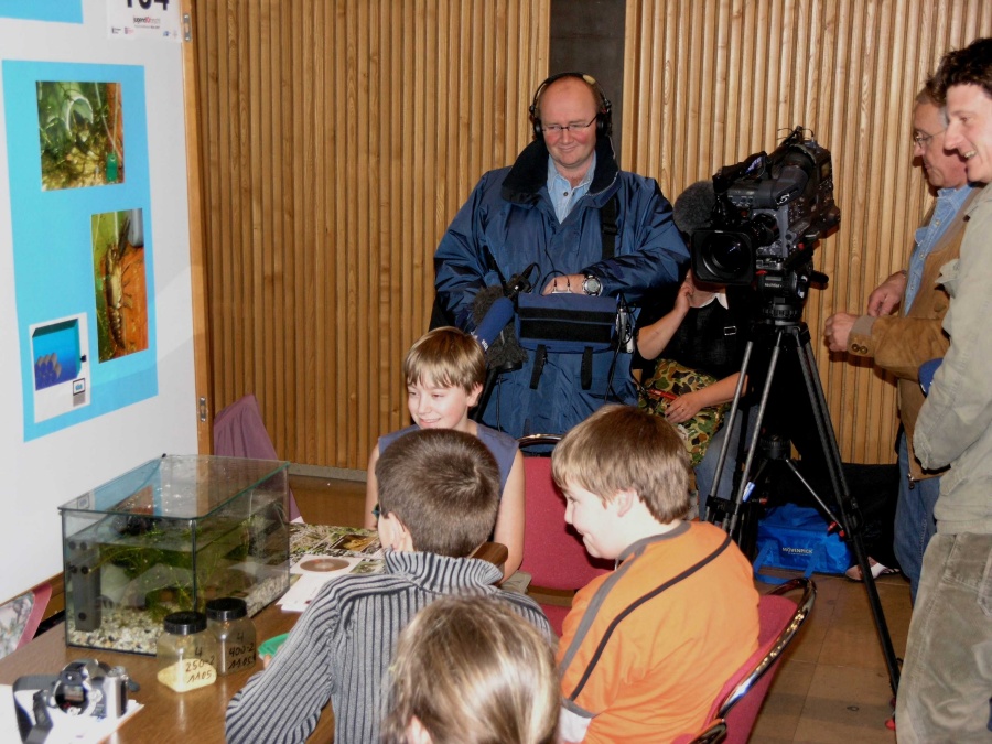 TV reporters interview our crayfish researchers at the regional contest